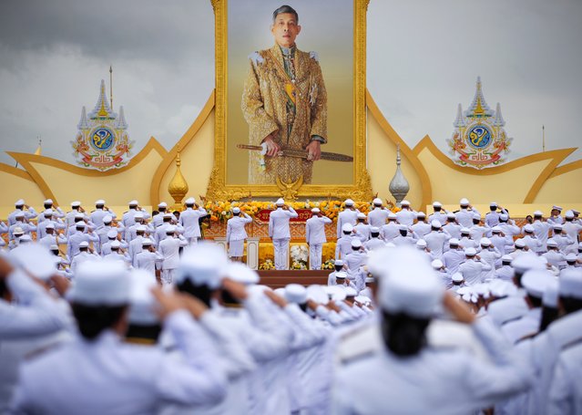 Thai officials salute to the portrait of the King while they take the oath of allegiance to become lawful civil servants to mark Thai King Maha Vajiralongkorn's 72nd birthday at Sanam Luang outside the Grand Palace in Bangkok, Thailand, 28 July 2024. Thai King Maha Vajiralongkorn Bodindradebayavarangkun celebrates his 72nd birthday on 28 July 2024. (Photo by Rungroj Yongrit/EPA/EFE)