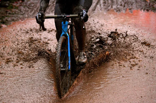 A cyclist rides through the mud during the 11th Namur World Cup in Namur, Belgium on December 22, 2019. (Photo by Luc Claessen/Getty Images)