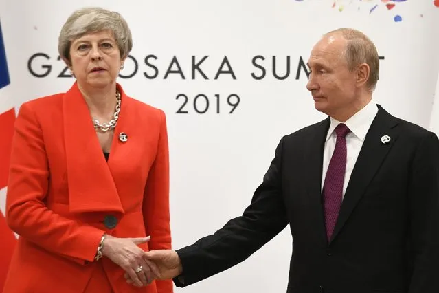 Prime Minister Theresa May meets Russian President Vladimir Putin during the G20 summit in Osaka, Japan on June 28, 2019. (Photo by Stefan Rousseau/PA Images via Getty Images)