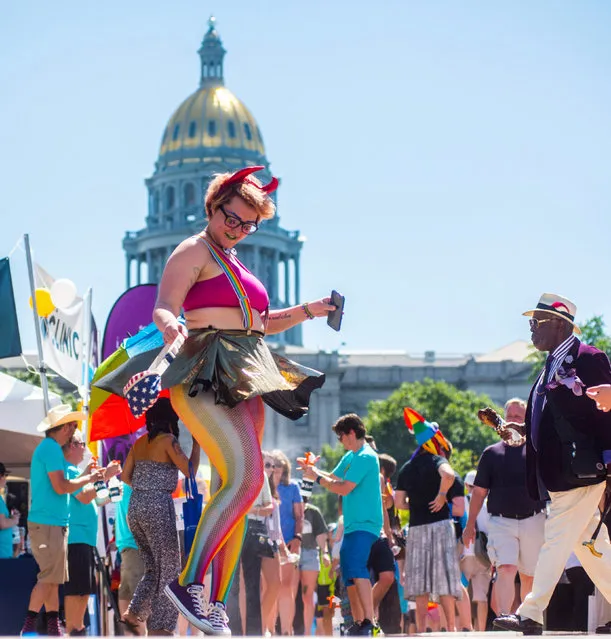 Participants in the Pridefest parade make their way through downtown Denver, Colorado, U.S., June 19, 2016. (Photo by Evan Semon/Reuters)