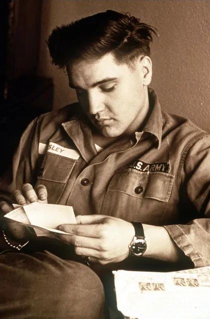 Presley in his army fatigues in this undated handout photo. Presley, born in Tupelo, Mississippi in 1935, died at his Memphis home of Graceland on 16 August 1977. (Photo by AFP Photo)