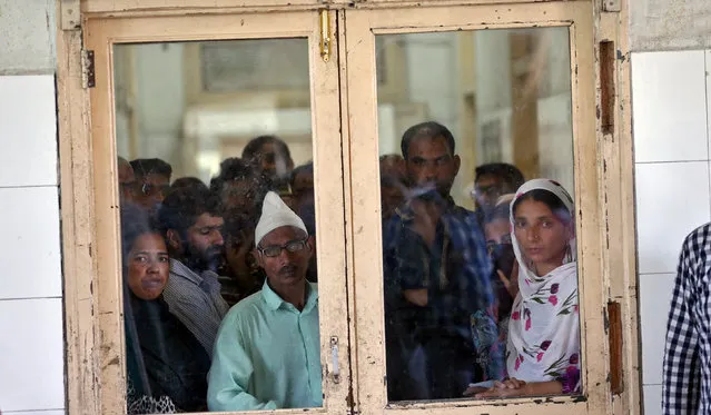 People wait for news at a hospital in Srinagar about family members whom they say were beaten by security forces near Srinagar following weeks of violence in Kashmir, August 18, 2016. (Photo by Cathal McNaughton/Reuters)