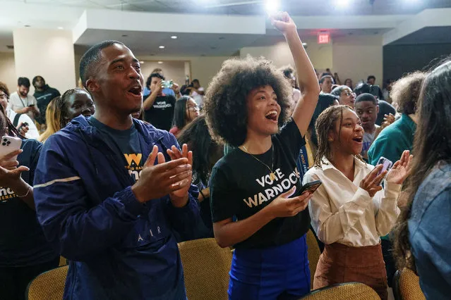 Students cheer as U.S. Senator Raphael Warnock walks on stage to speak at a campaign event at Georgia State University in Atlanta, Georgia, U.S. October 17, 2022. (Photo by Elijah Nouvelage/Reuters)