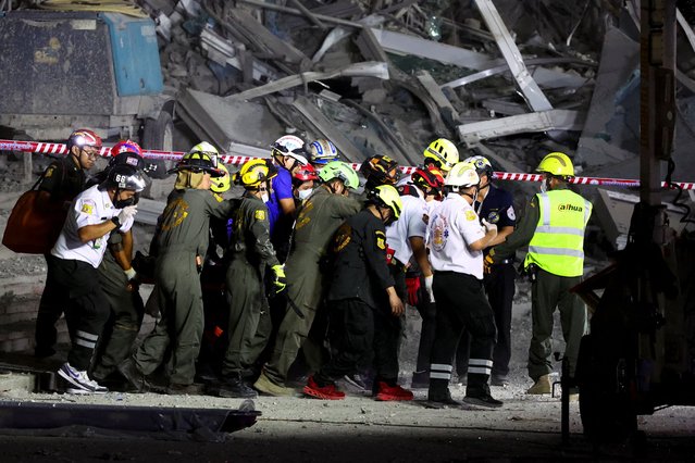 Rescue personnel peform CPR on a casualty who was rescued from the site of a building that collapsed in Bangkok, Thailand, on March 28, 2025. (Photo by Athit Perawongmetha/Reuters)