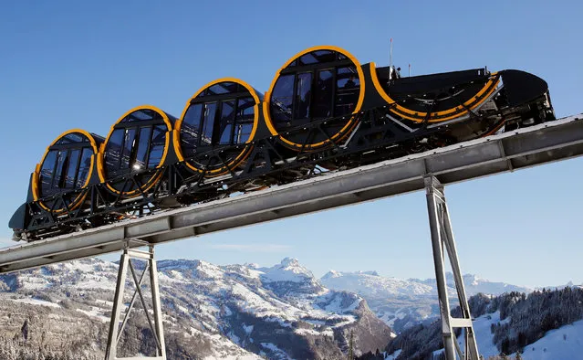 The barrel-shaped carriages of a new funicular line are seen during sunny winter weather in the Alpine resort of Stoos, Switzerland December 13, 2017. (Photo by Arnd Wiegmann/Reuters)