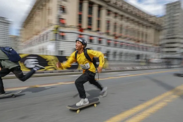 A skateboarder attends the Skate Run competition during the “Virada Esportiva”, a 24-hour multisport event promoted by Sao Paulo city hall, in Sao Paulo, Brazil, Sunday, November 6, 2022. (Photo by Marcelo Chello/AP Photo)