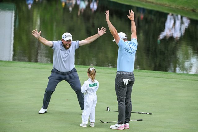 Shane Lowry, left, and Rory McIlroy celebrate a putt by McIlroy’s daughter, Poppy, during the Masters’ annual Par 3 Contest on Wednesday, April 9, 2025. (Photo by Ben Jared/PGA Tour/Getty Images)