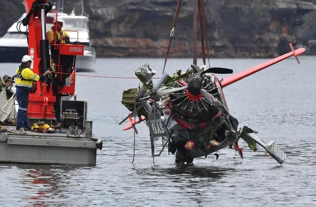 In this image a recovery vessel operates on the Hawkesbury River, New South Wales, Australia Thursday, January 4, 2018. Sections of the seaplane that crashed into the Hawkesbury river on Sunday were being recovered in a New South Wales Police operation on Thursday. (Photo by Australian Media Pool via AP Photo)