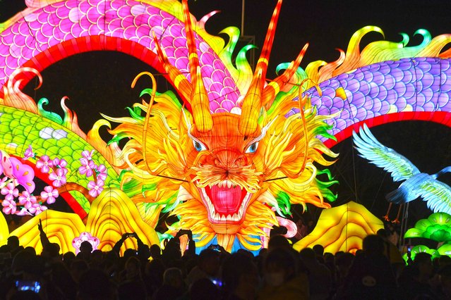People admire a giant dragon lantern in a lantern show in Wuhan in central China's Hubei province on Friday, February 16, 2024. (Photo by Shepherd Zhou/Avalon)