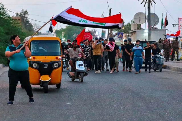 Protesters partake in an anti-government protest demanding free elections outside the provincial council building in Basra, Iraq, Tuesday, September 15, 2020. (Photo by Nabil al-Jurani/AP Photo)