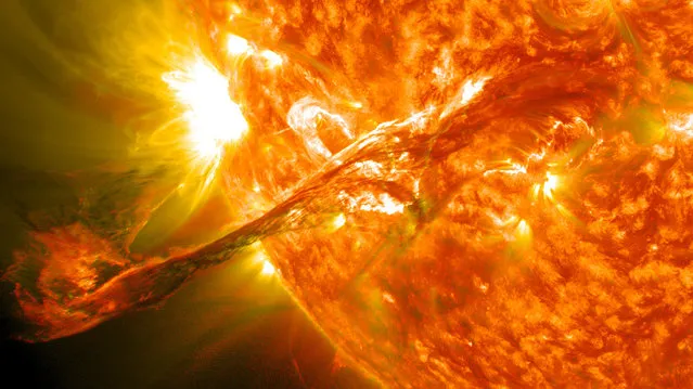 On August 31, 2012 a long filament of solar material that had been hovering in the sun's atmosphere, the corona, erupted out into space at 4:36 p.m. EDT. The coronal mass ejection, or CME, traveled at over 900 miles per second. The CME did not travel directly toward Earth, but did connect with Earth's magnetic environment, or magnetosphere, causing aurora to appear on the night of Monday, September 3. Picuted here is a lighten blended version of the 304 and 171 angstrom wavelengths. (Photo by NASA/GSFC/SDO)