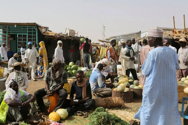 Vendors sell watermelons at a market in Agadez, Niger, May 11, 2016. (Photo by Joe Penney/Reuters)