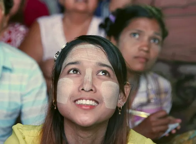 Supporters of National League for Democracy (NLD) leader Aung San Suu Kyi watch election results come in outside NLD offices in Mandalay, Myanmar, November 8, 2015. (Photo by Olivia Harris/Reuters)