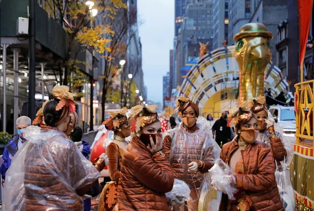 Participants gather ahead of the 94th Macy's Thanksgiving Day Parade closed to the spectators due to the spread of the coronavirus disease (COVID-19), in Manhattan, New York City, U.S., November 26, 2020. (Photo by Andrew Kelly/Reuters)