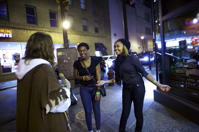 Two enthusiastic women greet Michael Grant, 28, “Philly Jesus”, in Philadelphia, Pennsylvania December 14, 2014. (Photo by Mark Makela/Reuters)