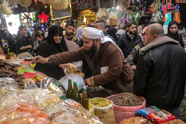 Palestinians buy groceries in preparation of the Muslim holy month of Ramadan at a market in Gaza City, Gaza Strip on March 22, 2023. Muslims around the world celebrate the holy month with prayers and readings from the Koran as they fast from eating, drinking, smoking and all sexual relations from dawn till dusk. (Photo by Mahmoud Issa/Quds Net News via ZUMA Press/Rex Features/Shutterstock)