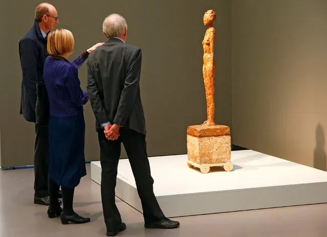People look at the sculpture “Woman with Chariot” during a media preview of the exhibition “Alberto Giacometti – Material and Vision” of late Swiss artist Alberto Giacometti at the Kunsthaus Zurich art museum in Zurich, Switzerland October 27, 2016. (Photo by Arnd Wiegmann/Reuters)