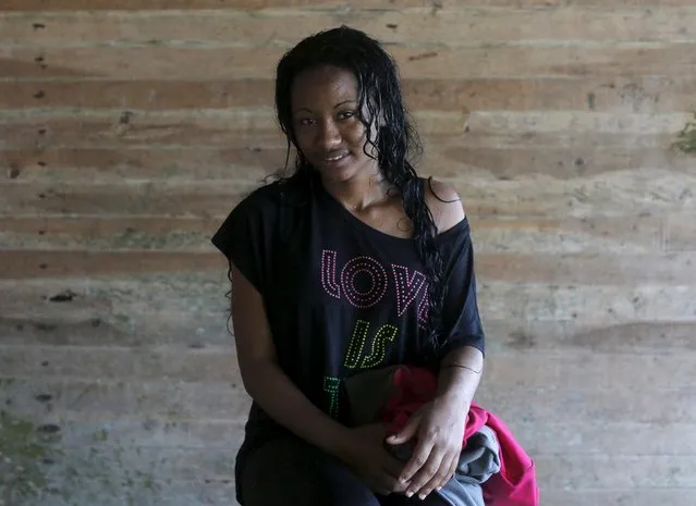 Cuban Daymara A., 20, poses for a photograph after she crossed the border from Colombia through the jungle into La Miel, in the province of Guna Yala, Panama December 2, 2015.  According to local authorities in La Miel, some 100 to 150 Cubans have been entering Panama from Colombia every day for the last three months. Scores of Cubans have come to Panama as they seek overland passage towards the United States fearing a recent detente between Washington and Havana could end their preferential treatment. (Photo by Carlos Jasso/Reuters)