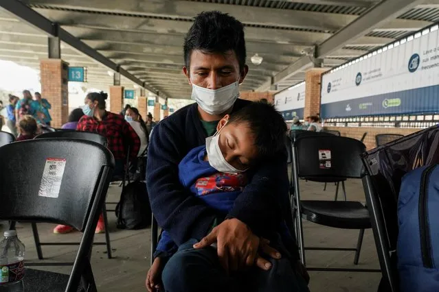 A migrant who crossed Gateway International Bridge from Mexico side to be processed to seek asylum in the U.S., waits with a child at a bus terminal to head to their destination, in Brownsville, Texas, February 25, 2021. The first asylum seekers from a Mexican border camp that had become a symbol of Trump era immigration restrictions entered the United States on Thursday under a new policy meant to end the hardships endured by migrants in dangerous border towns. (Photo by Go Nakamura/Reuters)