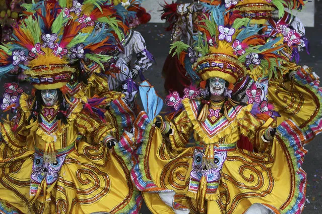Members of the South Philadelphia String Band perform during the 116th annual Mummers Parade in Philadelphia on Friday, January 1, 2016. Outrageously costumed Mummers strutted their stuff Friday at the city's annual New Year's Day parade, a colorful celebration that features string bands, comic brigades, elaborate floats and plenty of feathers and sequins. (Photo by Joseph Kaczmarek/AP Photo)