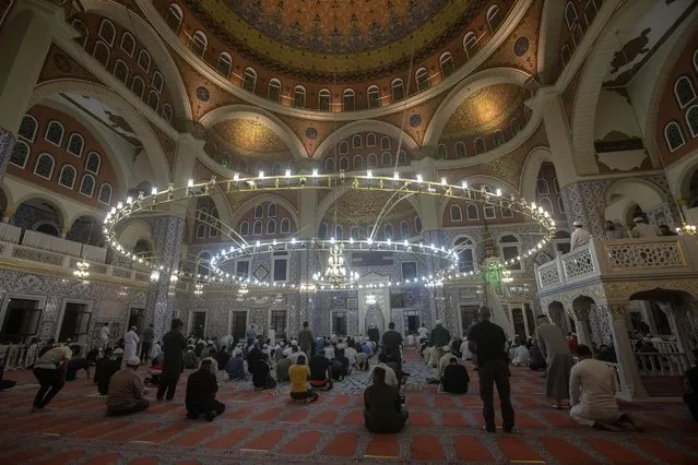 Worshipers pray as they mark the beginning of Ramadan at the Nizamiye Mosque in Johannesburg, South Africa, 13 April 2021. Muslims around the world celebrate the holy month of Ramadan by praying during the night time and abstaining from eating, drinking, and sexual acts during the period between sunrise and sunset. Ramadan is the ninth month in the Islamic calendar and it is believed that the revelation of the first verse in Koran was during its last 10 nights. The mosque is a copy of the “Blue Mosque” in Istanbul and was build by a Turkish businessman Ali Katircioglu. The mosque claims to be the biggest in the southern hemisphere. (Photo by Kim Ludbrook/EPA/EFE)