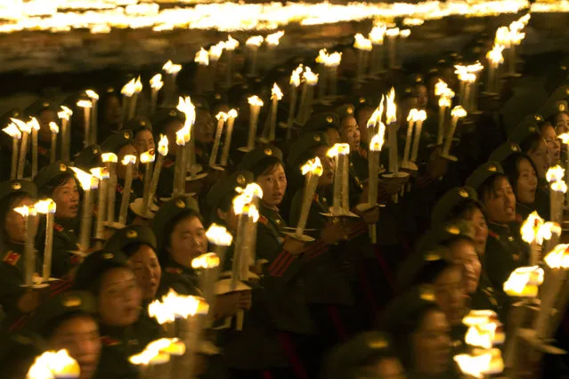 North Korean military cadets take part in a torch light march held in conjunction with the 70th anniversary of North Korea's founding day celebrations in Pyongyang, North Korea, Monday, September 10, 2018. (Photo by Ng Han Guan/AP Photo)