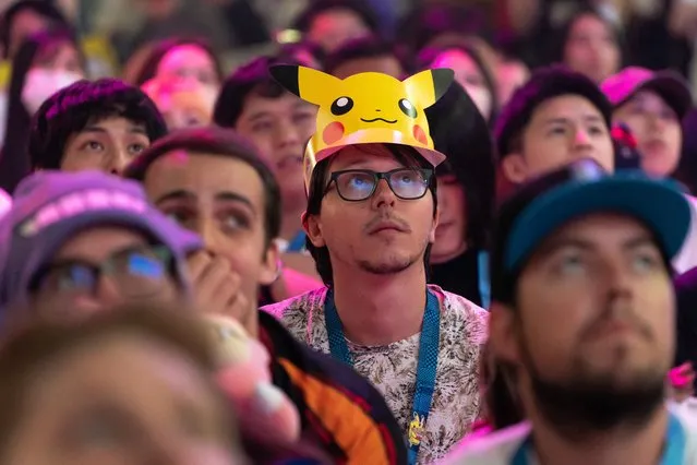 Spectators watch a Pokémon UNITE game during the 2023 Pokémon World Championships at the Pacifico Yokohama convention center on August 11, 2023 in Yokohama, Japan. The 2023 Pokémon World Championships is a combined gaming competition for Pokémon Scarlet and Violet, Pokémon Trading Card Game, Pokémon GO, and Pokémon UNITE games. It is the first time the event has been held in Japan and takes place from August 11 to 13. (Photo by Tomohiro Ohsumi/Getty Images)