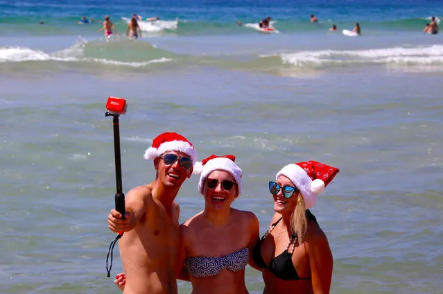 English tourists take a selfie as they celebrate Christmas Day at Sydney's Bondi Beach in Australia, December 25, 2016. (Photo by David Gray/Reuters)