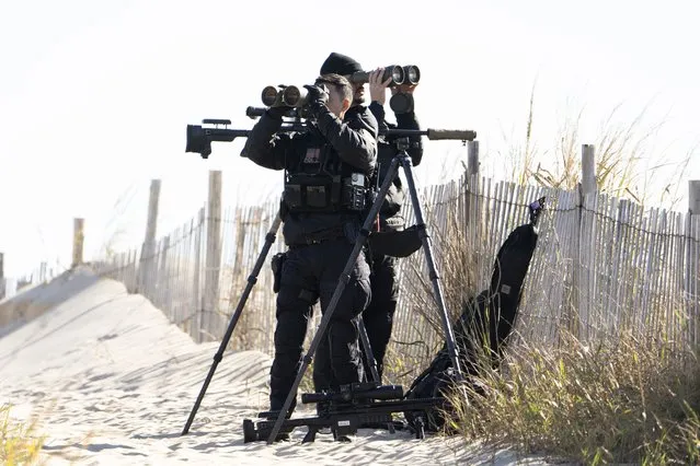 Members of the U.S. Secret Service Counter Sniper Team, secure the perimeter as the motorcade of President Joe Biden arrives at Gordons Pond State Park in Rehoboth Beach, Del., Monday, October 23, 2023. (Photo by Manuel Balce Ceneta/AP Photo)