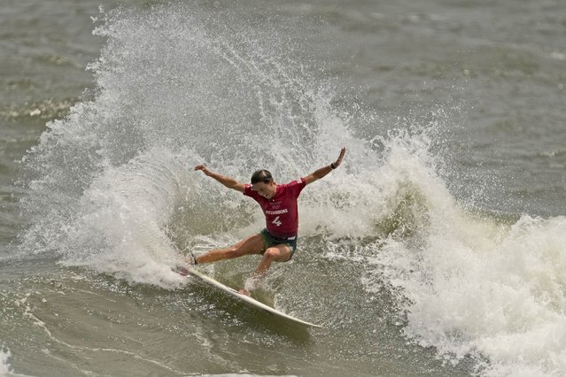 Australia's Sally Fitzgibbons maneuvers on a wave during third round of women's surfing competition at the 2020 Summer Olympics, Monday, July 26, 2021, at Tsurigasaki beach in Ichinomiya, Japan. (Photo by Francisco Seco/AP Photo)