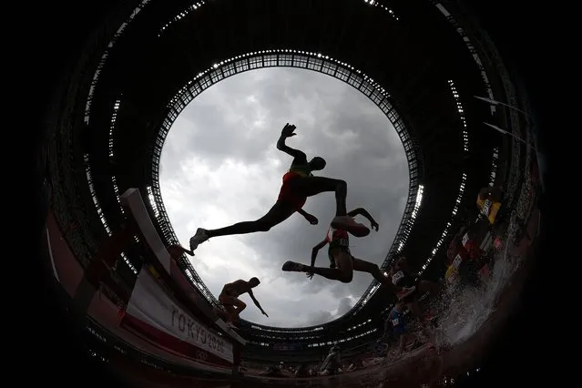 Athletes compete during round one of the Men's 3000m Steeplechase heats on day seven of the Tokyo 2020 Olympic Games at Olympic Stadium on July 30, 2021 in Tokyo, Japan. (Photo by Matthias Hangst/Getty Images)