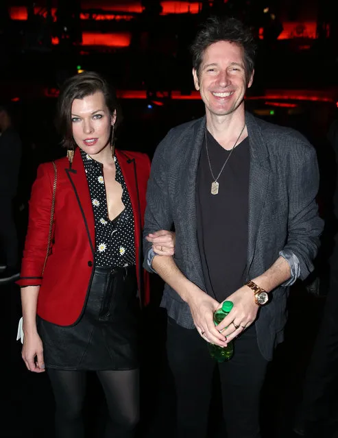 Milla Jovovich, left, and Paul W. S. Anderson attend Saint Laurent at the Palladium on Wednesday, February 10, 2016 in Los Angeles. (Photo by Matt Sayles/Invision/AP Photo)