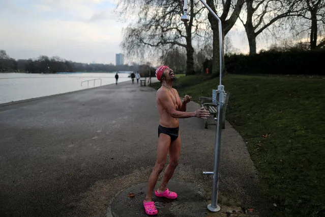 A man reacts as he realises the shower water has frozen after a cold morning swim in Serpentine Lake in London, Britain February 2, 2019. (Photo by Simon Dawson/Reuters)