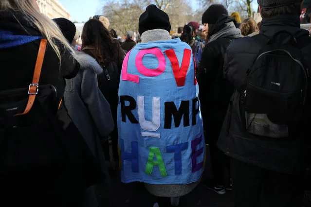 A protester wears a blanket with “Love U, Trump Hate” during the Women's March on January 21, 2017 in London, England. The Women's March originated in Washington DC but soon spread to be a global march calling on all concerned citizens to stand up for equality, diversity and inclusion and for women's rights to be recognised around the world as human rights. Global marches are now being held, on the same day, across seven continents.  (Photo by Dan Kitwood/Getty Images)