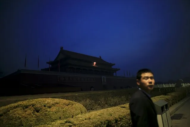 A security agent stands guard in front of the Tiananmen Gate as the area near the Great Hall of the People is prepared for upcoming annual sessions of the National People's Congress (NPC) and Chinese People's Political Consultative Conference (CPPCC) in Beijing March 3, 2016. (Photo by Aly Song/Reuters)