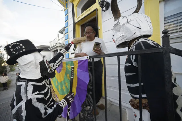 The North Side Skull and Bones Gang wakes up Treme on Mardi Gras morning in New Orleans, La. Tuesday, March 5, 2019. The gang is celebrating its 200th year. (Photo by Max Becherer/The Advocate via AP Photo)