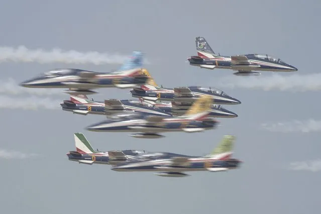 Aircraft from the Italian air force's Frecce Tricolori fly at the Dubai Air Show in Dubai, United Arab Emirates, Wednesday, November 15, 2023. (Photo by Jon Gambrell/AP Photo)