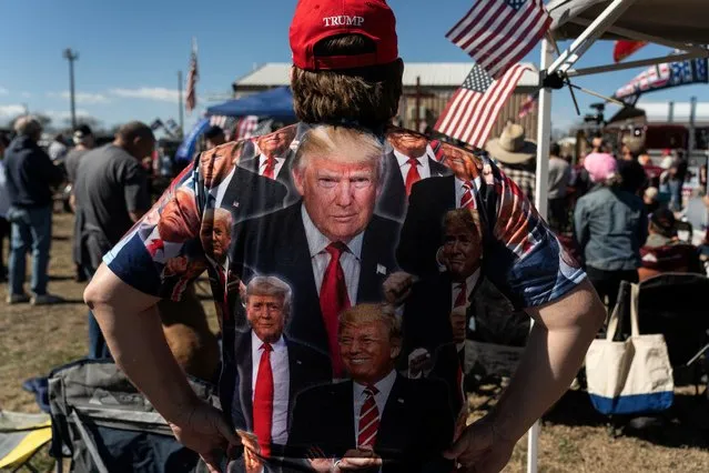 A participant of “Take Back Our Border” trucker convoy rally against migrants crossing from Mexico, wears a Trump t-shirt during the event in Quemado, Texas, U.S., February 3, 2024. (Photo by Go Nakamura/Reuters)