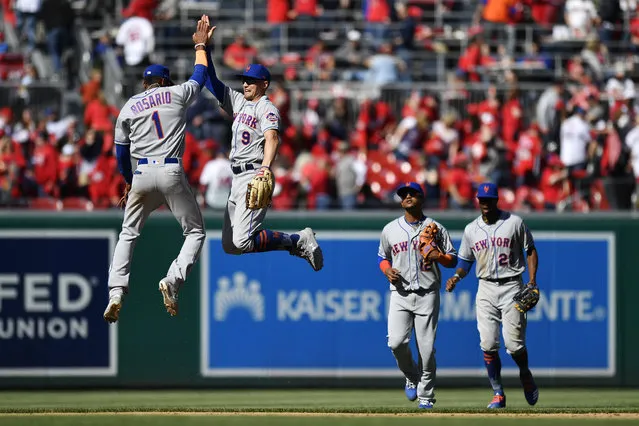 Amed Rosario #1 and Brandon Nimmo #9 of the New York Mets celebrate after the Mets defeated the Washington Nationals 2-0 on Opening Day at Nationals Park on March 28, 2019 in Washington, DC. (Photo by Patrick McDermott/Getty Images)