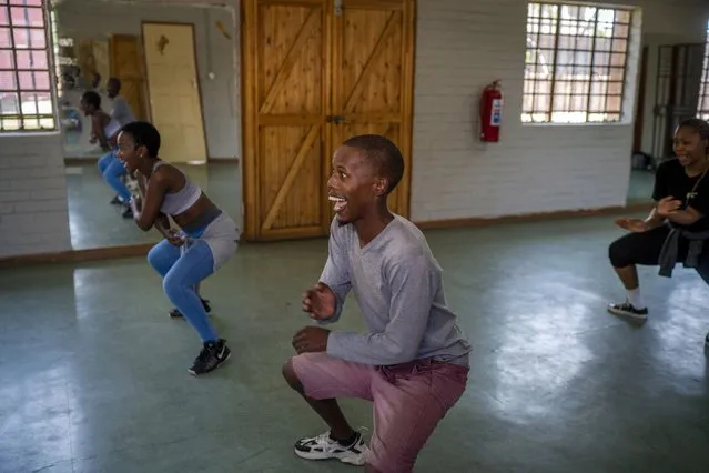Tsimamkele Crankydy Xako, 28, center, a professional dancer, practices with others at the Soweto Moves Projects dance studio in Soweto, South Africa, Tuesday October 5, 2021. (Photo by Jerome Delay/AP Photo)