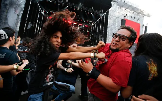 Fans of Swedish heavy metal band “Avatar” mosh during their performance at the Domination music festival in Mexico City, Friday, May 3, 2019. (Photo by Eduardo Verdugo/AP Photo)