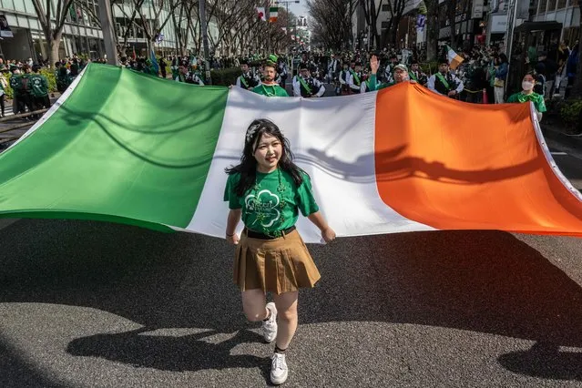 People take part in a St. Patrick's Day parade in Tokyo on March 17, 2024. (Photo by Yuichi Yamazaki/AFP Photo)