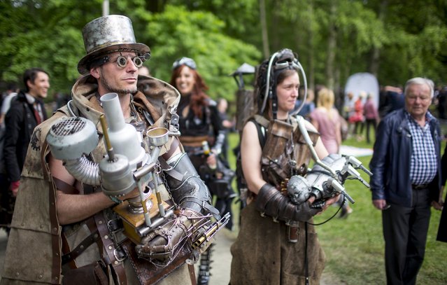Revellers attend the Victorian Picnic during the Wave and Goth festival in Leipzig, Germany, May 22, 2015. The annual festival, known in Germany as Wave-Gotik Treffen (WGT), features over 100 bands and artists in venues all over the city playing Gothic rock and other styles of the dark wave music subculture. One of the biggest of its kind, the event attracts a regular audience of up to 20,000, the organisers said. (Photo by Hannibal Hanschke/Reuters)