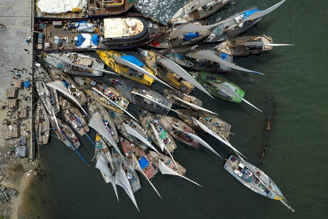 A drone view shows wooden sailboats docked in Cap-Haitien, Haiti on April 25, 2024. (Photo by Ricardo Arduengo/Reuters)