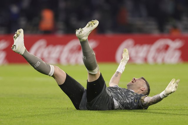 Goalkeeper Guido Herrera of Argentina's Talleres celebrates after teammate Gustavo Bou scored their side's third goal against Ecuador's Barcelona during a Copa Libertadores Group B soccer match at Mario Alberto Kempes stadium in Cordoba, Argentina, Wednesday, May 8, 2024. (Photo by Nicolas Aguilera/AP Photo)