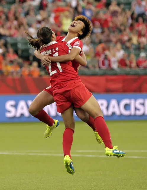 China PR midfielder Wang Lisi (21) celebrates after scoring a goal against Netherlands in Edmonton, June 11, 2015. (Photo by Erich Schlegel/USA TODAY Sports)