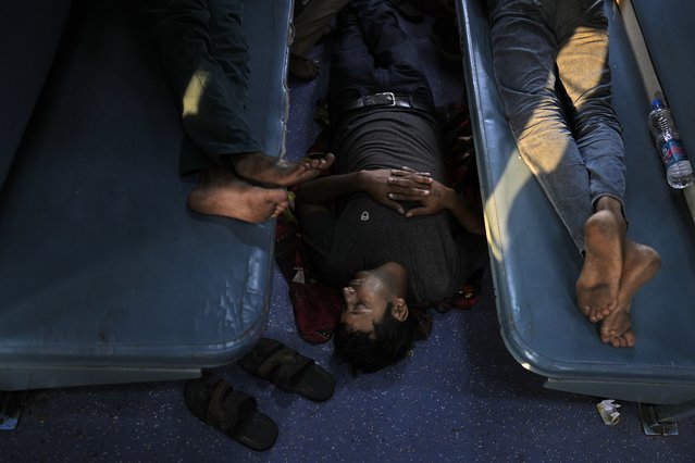 Passengers rest in a general class of the Thirukkural Express, India, Sunday, April 21, 2024. (Photo by Manish Swarup/AP Photo)