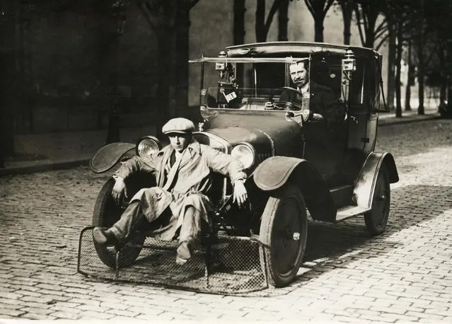 French police checking a safety device mounted at the front of a car. Date: 1924. (Photo by Mary Evans Picture Library/Caters News)