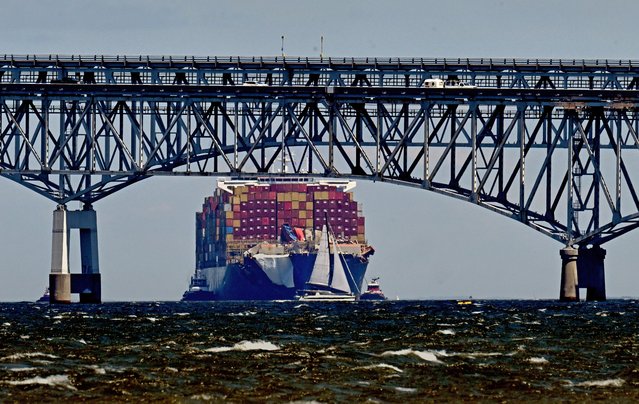 The container ship MV Dali traveled under the Chesapeake Bay Bridge in Stevensville, Maryland on June 24, 2024. Photos were taken from Matapeake Park beach and show the damaged ship as it travels to Norfolk for repairs. The ship destroyed most of the Francis Scott Key Bridge when it collided with it in March. (Photo by Michael S. Williamson/The Washington Post)