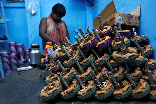A worker assembles ceiling fan motors at a workshop in Kolkata, India, May 2, 2016. (Photo by Rupak De Chowdhuri/Reuters)